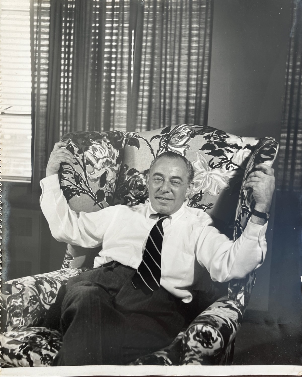 IV. American Composer. [In armchair] 1902 - 79. Photographed by DOUGLAS GLASS.